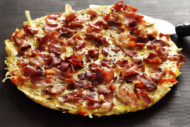 This hash browns recipe is a one-skillet dish. Top with bacon, slide it out, slice and serve. Super easy!