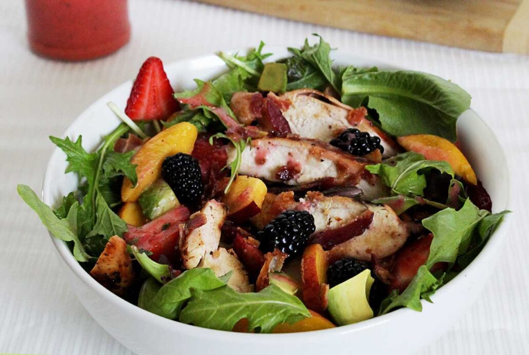easy paleo recipe for a greens and berry summer salad