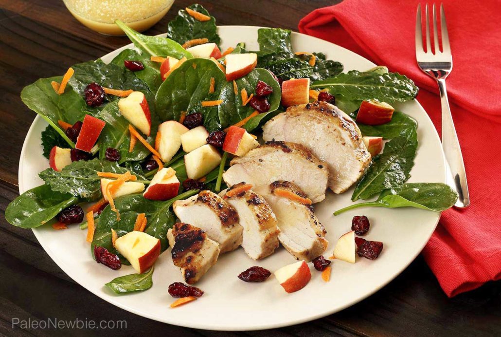 simple paleo salad featuring kale with added spinach, apples, cranberries and more.
