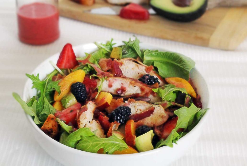 easy paleo salad with chicken, summer berries, and a simple recipe for a strawberry vinaigrette