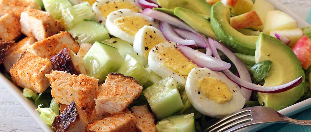 Simple chopped paleo chicken salad with a homemade honey-mustard sauce