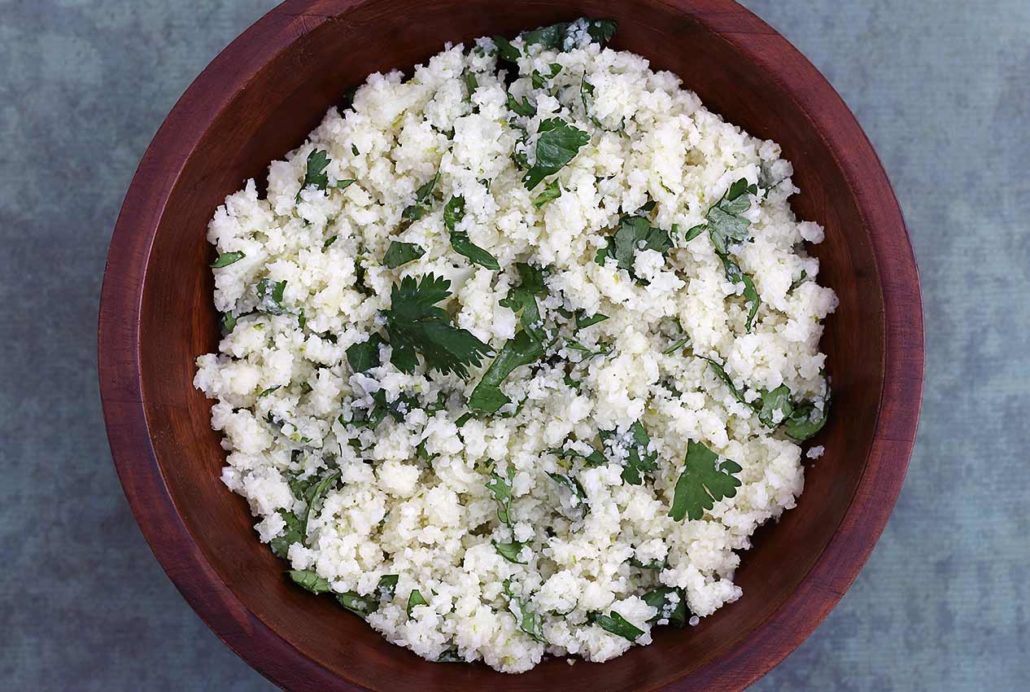 easy recipe for a grain-free rice using cauliflower and flavored with cilantro and broth