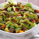 easy paleo and gluten free recipe for a shredded beef salad with avocado-lime dressing