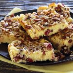 easy paleo and gluten-free recipe for lemon bars made with lemons, cranberries and nuts
