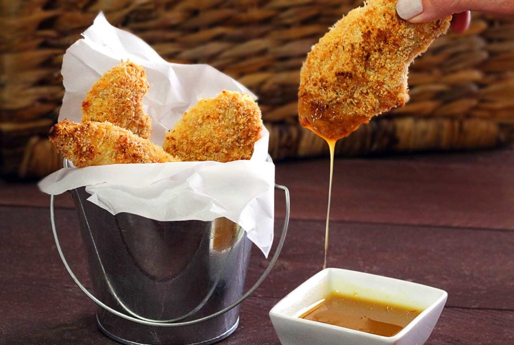 easy paleo recipe for baked chicken fingers with a simple honey-mustard dipping sauce