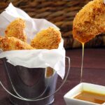 easy paleo and gluten-free recipe for baked chicken fingers with a quick honey-mustard dipping sauce