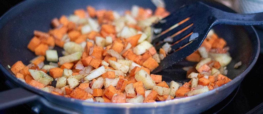 easy paleo hash recipe featuring sausage, apples, potato, and cranberries